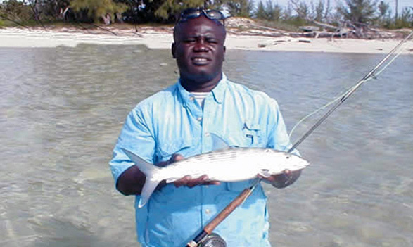 Fisherman Holding Fish in Bahamas
